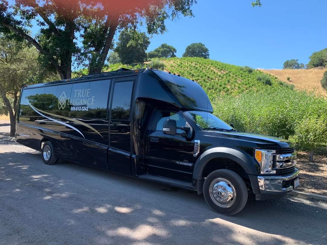 Wine tour shuttle bus parked at a vineyard