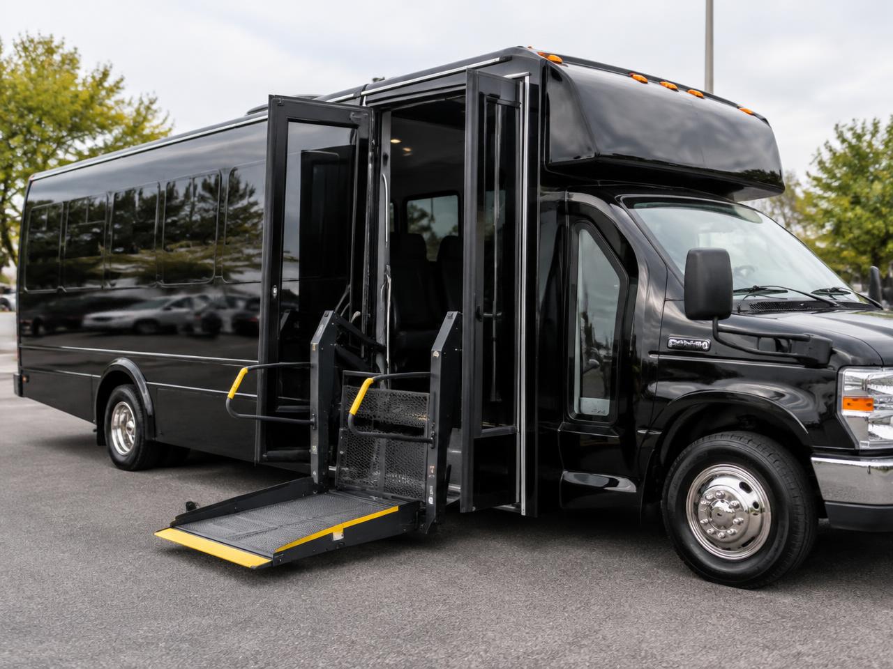 Black wheelchair-accessible shuttle bus with the lift platform deployed